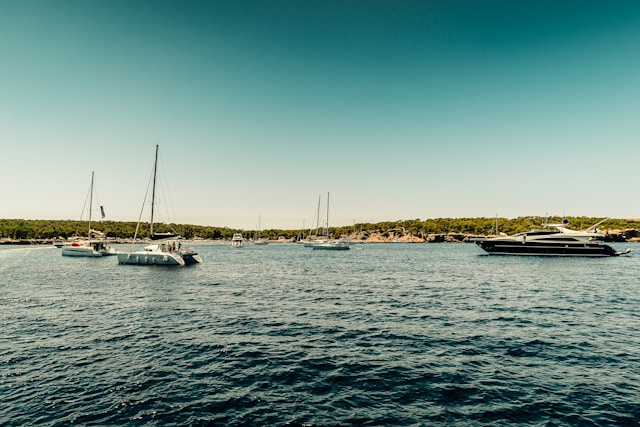 white-boat-on-sea-during-daytime